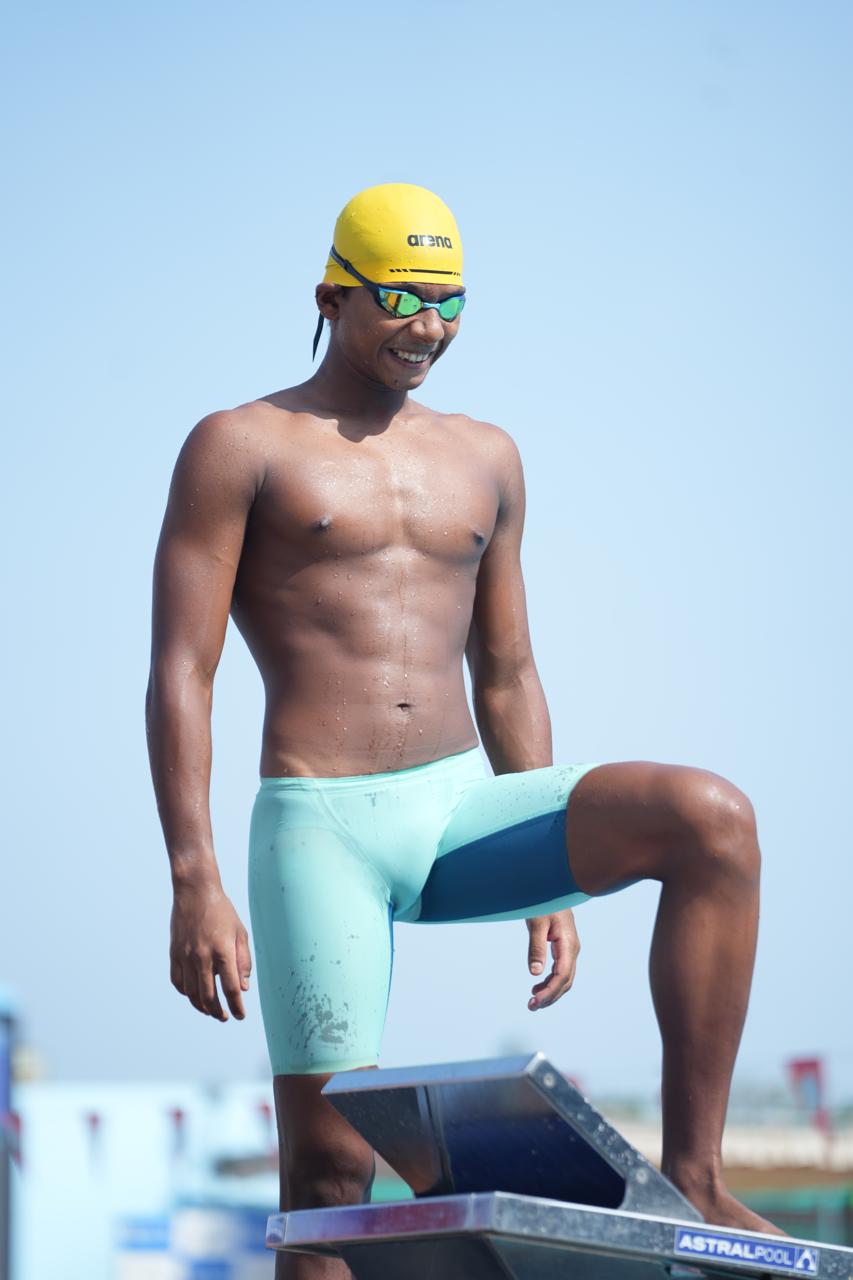 V. Kavin Raj wearing a yellow race cap and goggles